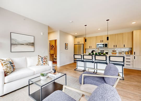 a living room with a couch and a glass table