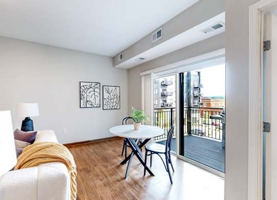 A living room with a white couch and a small table.