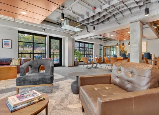 the lobby of a building with couches and chairs