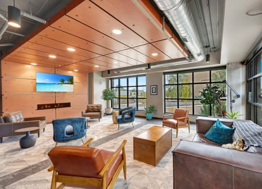 a large living room with furniture and large windows