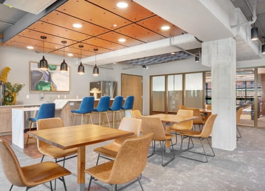 a dining room with tables and chairs and a bar