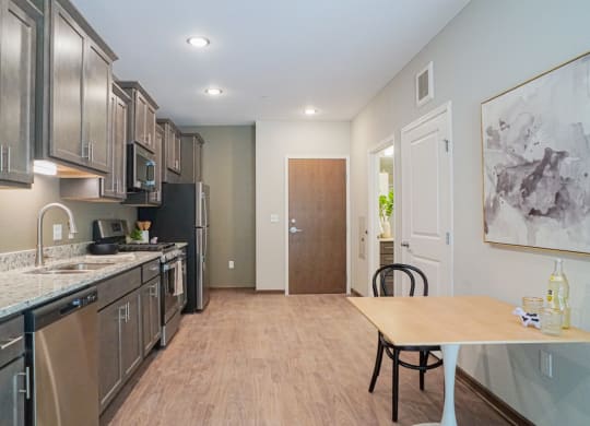 a kitchen and dining area at The Yards and Backyards, Saint Paul, MN