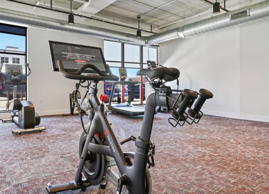a gym with bikes and other exercise equipment at Tyler Street Stacks, Minnesota, 55413