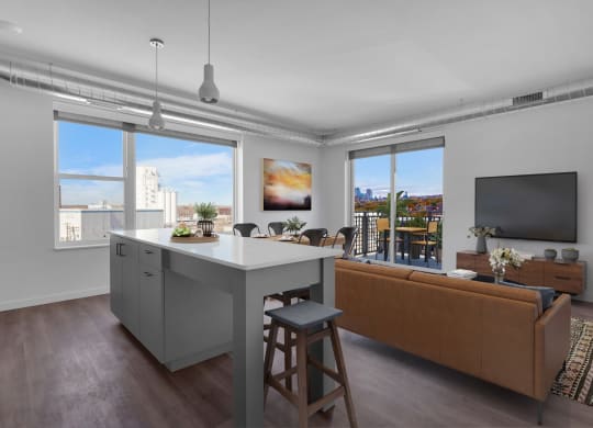 an open living room with a kitchen island and a living room at Tyler Street Stacks, Minneapolis, MN 55413
