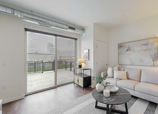 Living Room With Balcony Access at Tyler Street Stacks, Minneapolis, MN