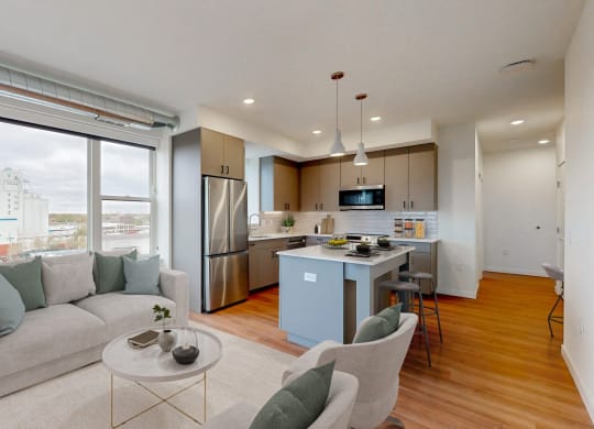 a living room and kitchen with a couch and a table at Tyler Street Stacks, Minnesota, 55413