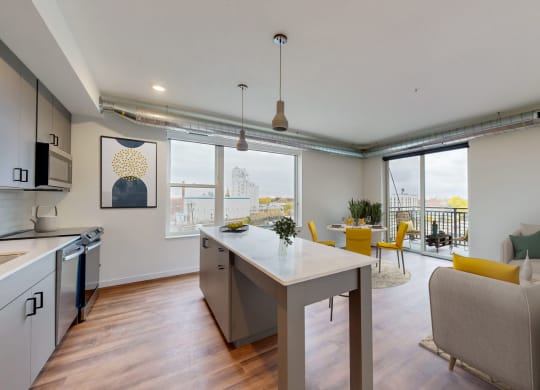 a living room with a kitchen and a dining room at Tyler Street Stacks, Minneapolis Minnesota