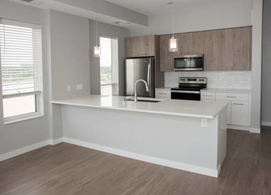 1 bedroom joel kitchen with breakfast bar at Urban Park I and II Apartments, St Louis Park, MN, 55426