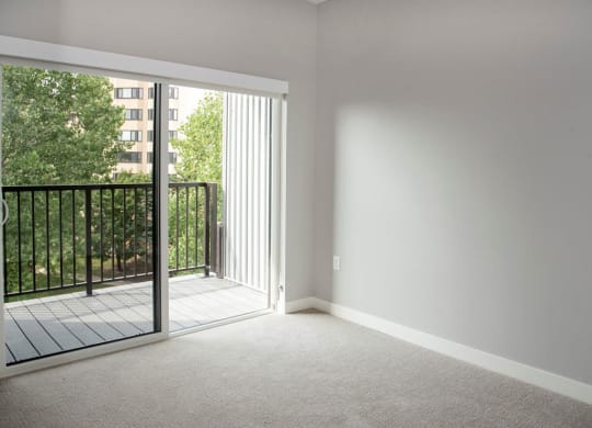 Nordic bedroom with tv wall and balcony at Urban Park I and II Apartments, St Louis Park, 55426