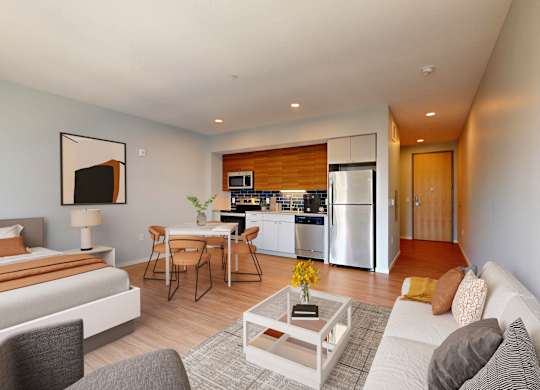 A modern living room with a grey couch and a coffee table.