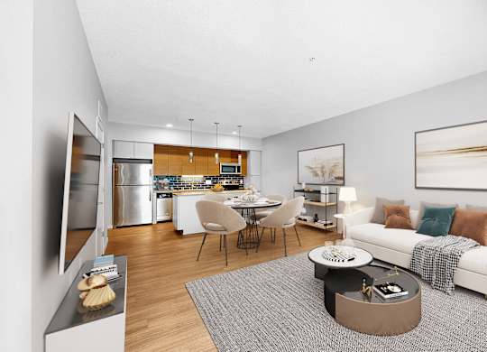 A modern living room with a kitchen in the background.