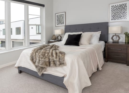 Bedroom with cozy bed at Volo at Texa Tonka Apartments , St Louis Park, 55426