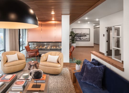 a living room filled with furniture and a fire place