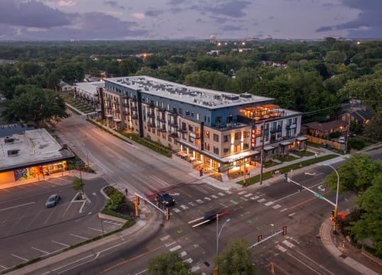 an aerial view of a large building on a city street