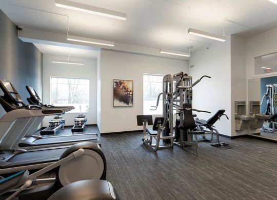 Multi-functional gym with 5 equipment stations for strength training at Waterstone Place in Minnetonka, MN