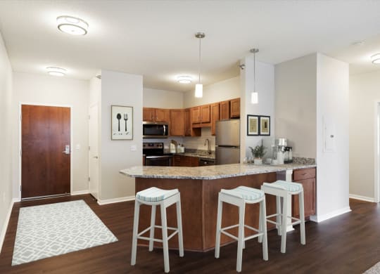 Well Organized Kitchen with Island at Waterstone Place in Minnetonka, MN