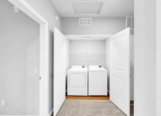 A laundry room with a washer and dryer.
