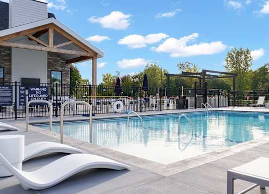 A pool area with a sign that says