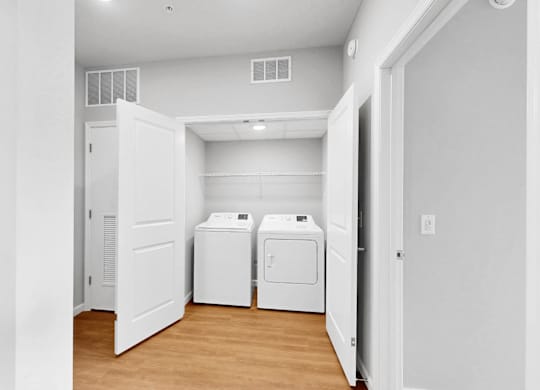 A laundry room with a washer and dryer.