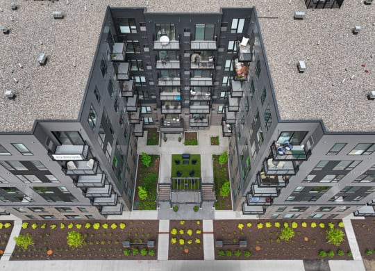 a birdseye view of a large apartment building