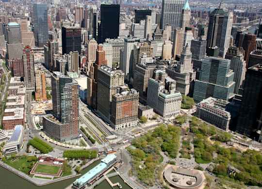 A cityscape with a large body of water in the foreground at One West, New York, New York