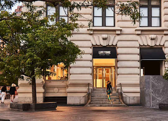 A building with a black awning that says at One West,  New York,10004