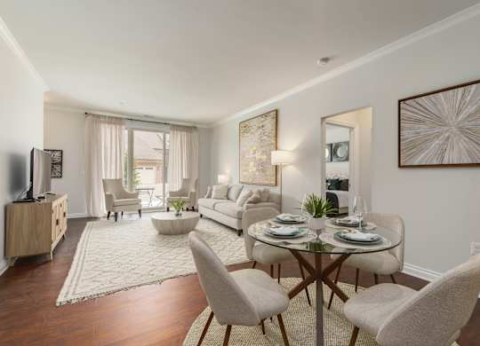 a living room with a table and chairs and a couch