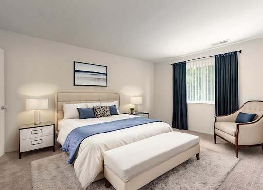 a bedroom with a bed and a chair