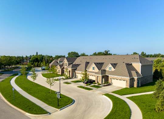 a large house with a street in front of it