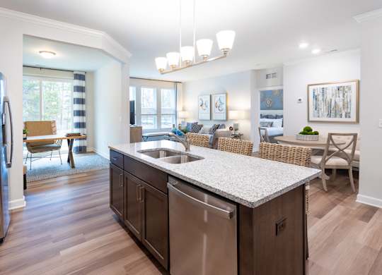 A modern kitchen with dark wood cabinets and stainless steel appliances.