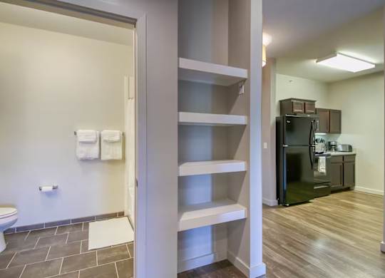 A bathroom with a toilet and a walk-in shower.