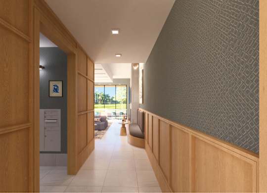 A hallway with a carpeted floor and a wall on the right side.