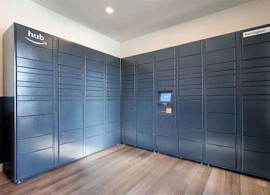 A row of Amazon Web Services storage units are lined up in a room.