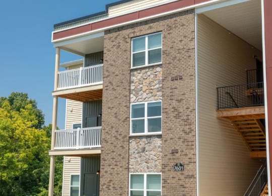 two pictures of a building with balconies and a tree