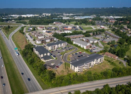 an aerial view of a city with buildings and a highway