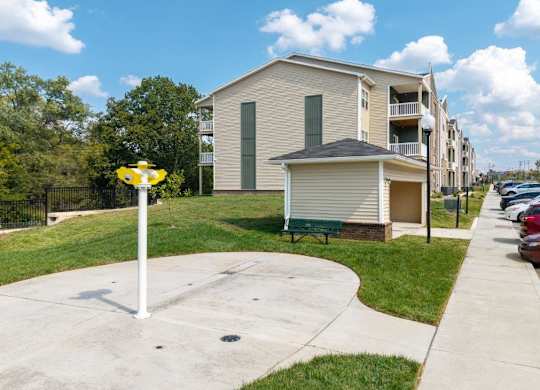 A residential area with apartment buildings and a street sign.