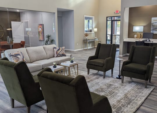 a living room with couches chairs and a rug