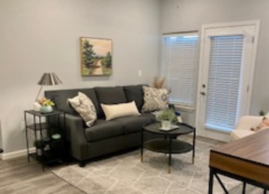a living room with a couch and a table