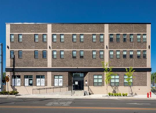 a large brick building on the side of a street