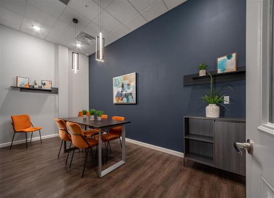 a dining room with a table and chairs