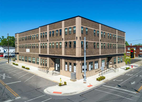 a brick building on the corner of a city street