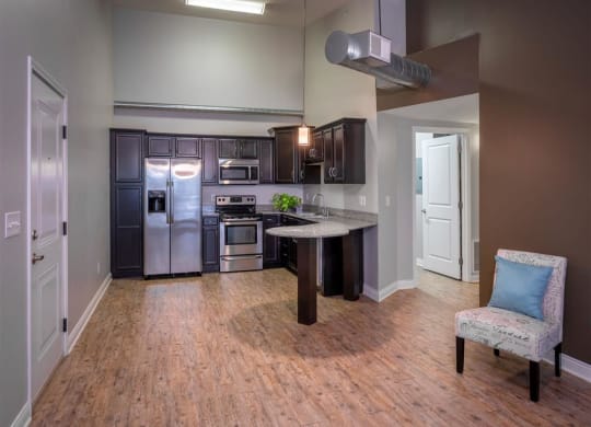 a kitchen with stainless steel appliances and a counter top