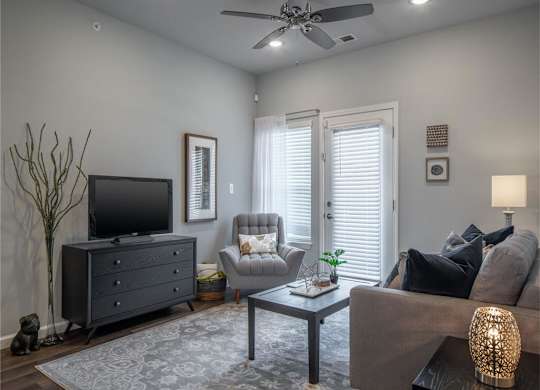 a living room with a couch and a tv