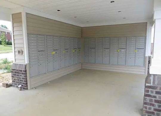 an empty room with rows of lockers on the wall