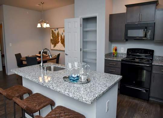 a kitchen with a granite counter top