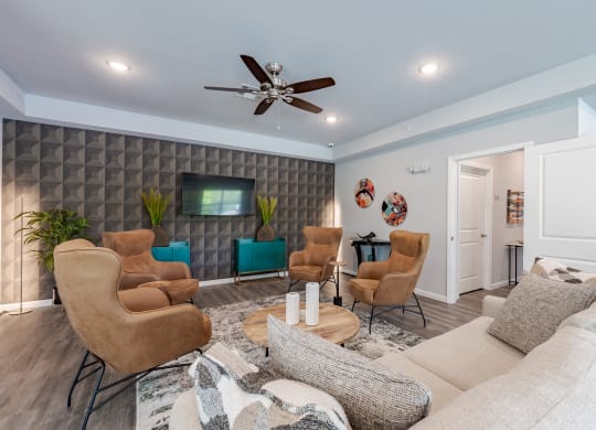 a living room with a couch and chairs