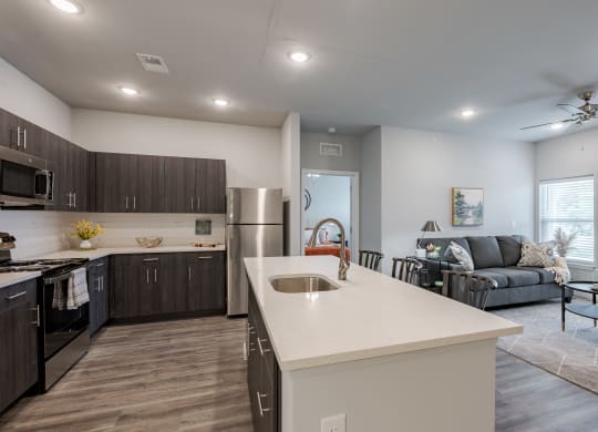 an open floor plan with a kitchen and living room