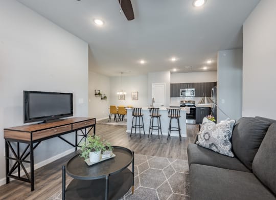 a living room with a couch and a table with a tv