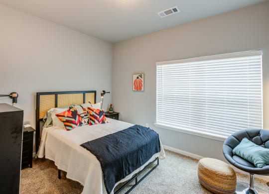 bedrooms with oversized windows at the preserve at great pond apartments in windsor tx