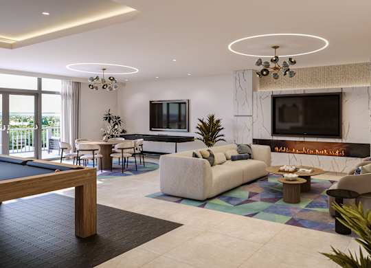 A modern living room with a pool table and a fireplace.